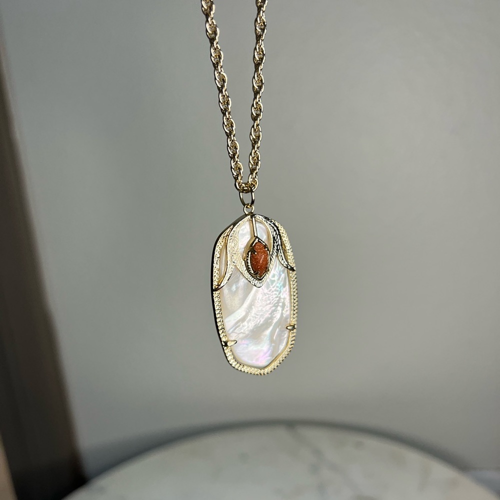 Long Kendra Scott Necklace with Large Dani pendant.